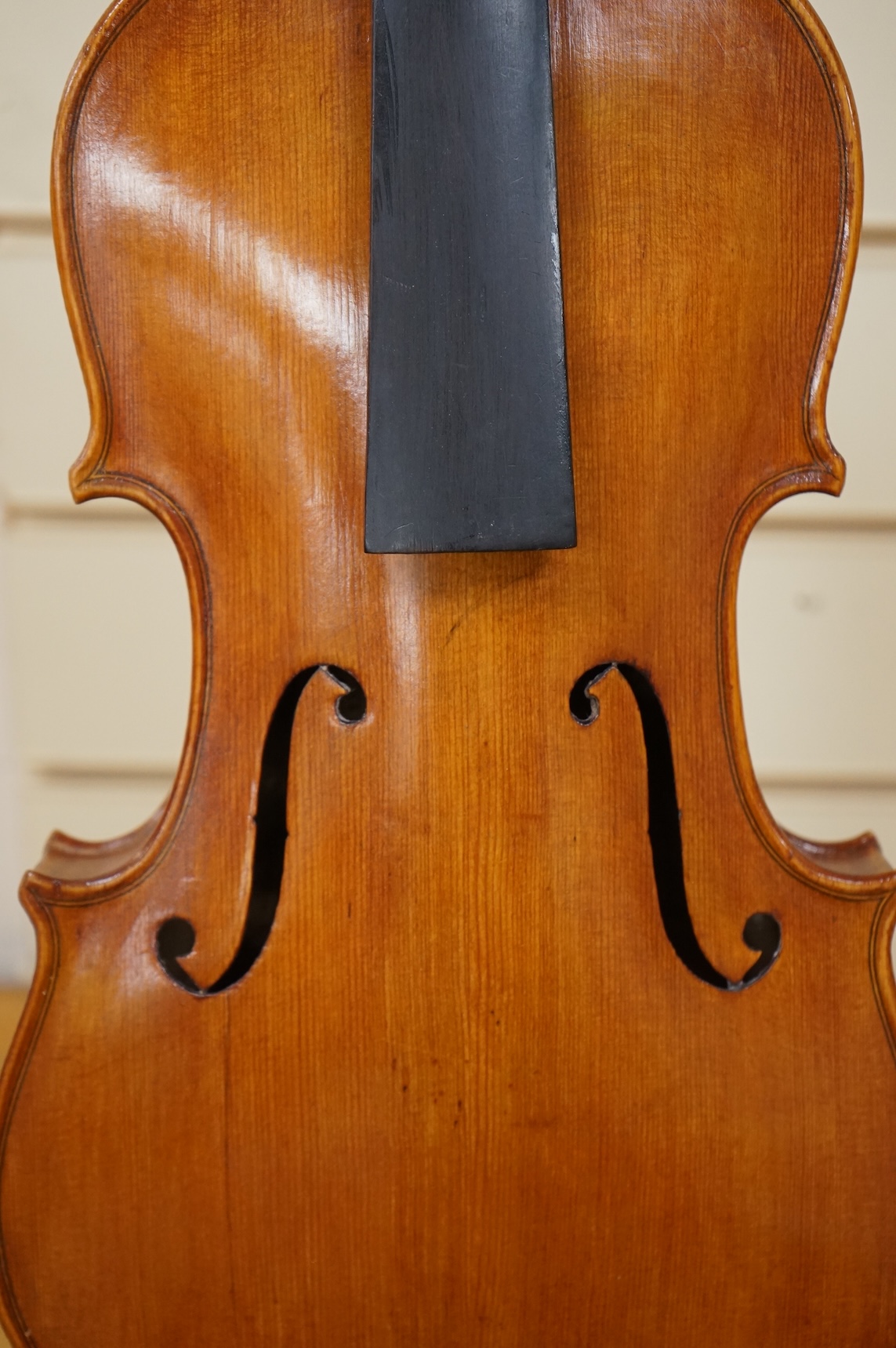 Four violins; a German Dresden violin, together with further two German violins, and a Saxony violin, three in cases or the remains of cases.